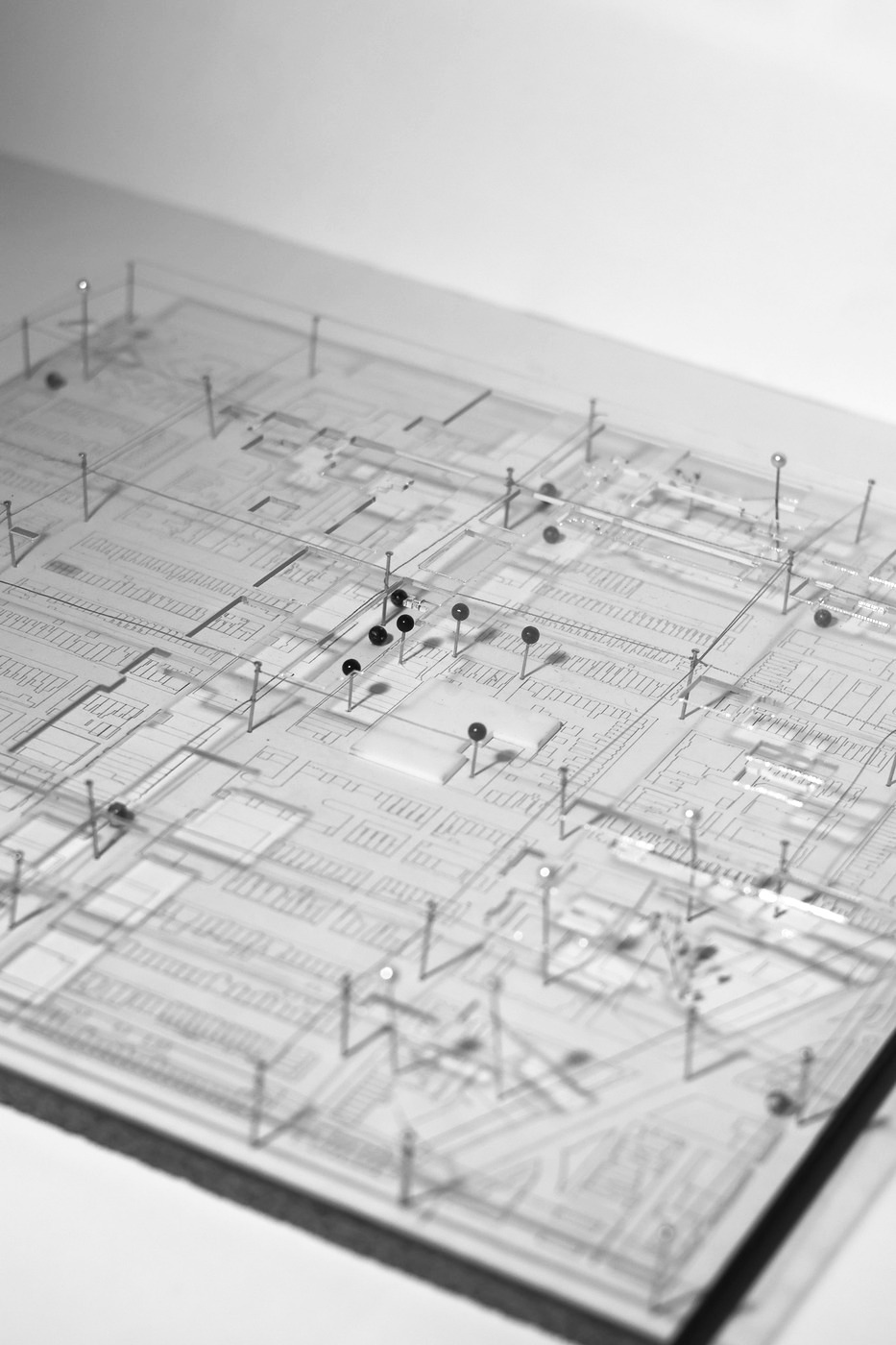 Site model in acrylic, pins and thread mapping the corridor.